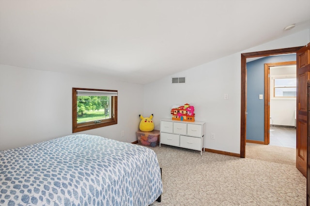 5090 Schrah Dr, Munith, MI 49259 - bedroom with vaulted ceiling and light colored carpet