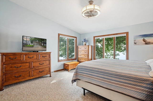 5090 Schrah Dr, Munith, MI 49259 - bedroom with multiple windows, lofted ceiling, and light colored carpet