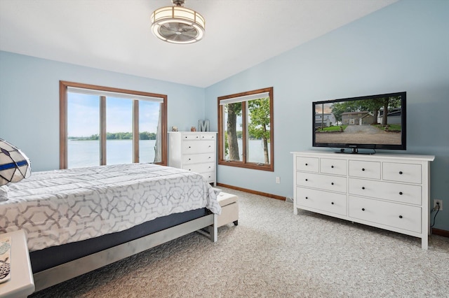 5090 Schrah Dr, Munith, MI 49259 - bedroom featuring vaulted ceiling, light carpet, and access to outside