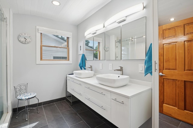 5090 Schrah Dr, Munith, MI 49259 - bathroom featuring recessed lighting, double vanity, a shower with door, and tile patterned flooring