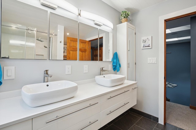 5090 Schrah Dr, Munith, MI 49259 - bathroom with tile patterned flooring, double vanity, and a shower with door