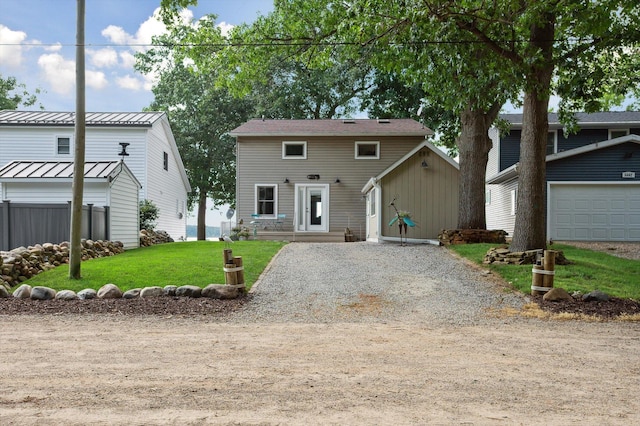 5090 Schrah Dr, Munith, MI 49259 - view of front facade with gravel driveway