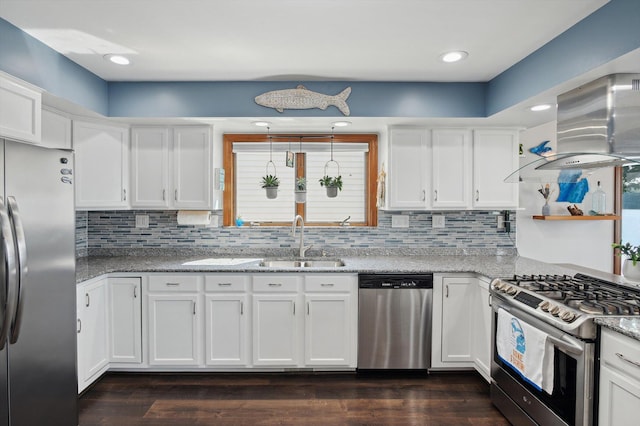 5090 Schrah Dr, Munith, MI 49259 - kitchen featuring appliances with stainless steel finishes, white cabinetry, decorative backsplash, and recessed lighting