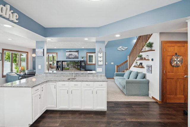 5090 Schrah Dr, Munith, MI 49259 - kitchen featuring open floor plan, light stone counters, dark wood finished floors, white cabinets, and recessed lighting