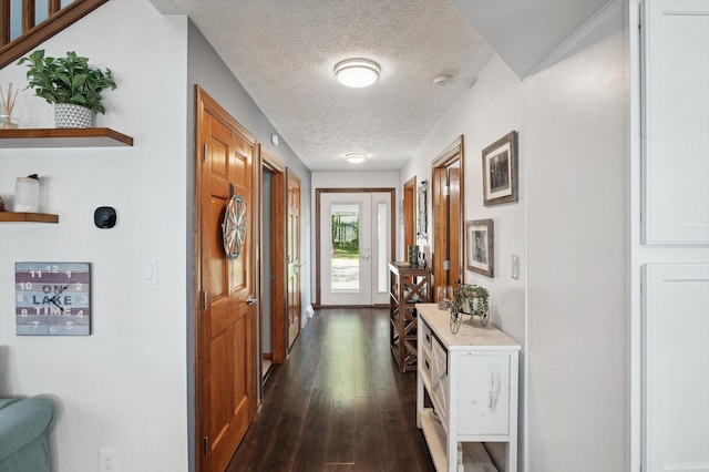5090 Schrah Dr, Munith, MI 49259 - hallway with dark wood-style floors and a textured ceiling