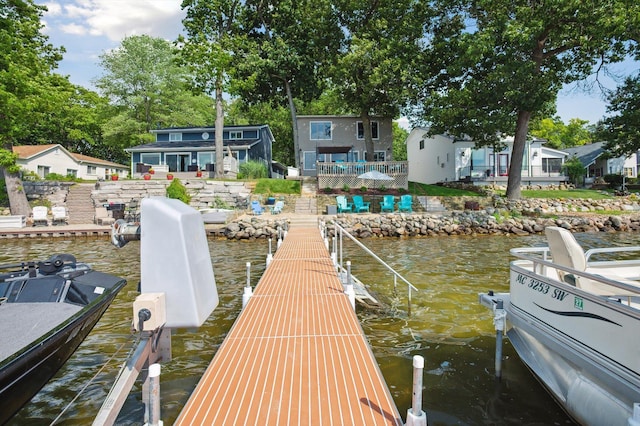 5090 Schrah Dr, Munith, MI 49259 - dock area featuring a deck with water view