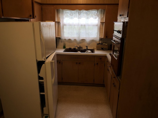 1483 Rose Ave, Benton Harbor, MI 49022 - kitchen featuring freestanding refrigerator, oven, light countertops, and backsplash