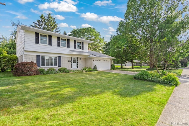 36393 Dardanella St, Livonia, MI 48152 - view of front of property featuring an attached garage, brick siding, driveway, and a front yard