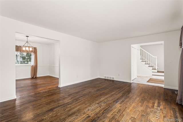 36393 Dardanella St, Livonia, MI 48152 - spare room with a chandelier, dark wood-style flooring, and stairs