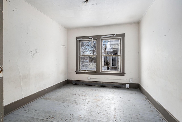 174 Cherry St, Battle Creek, MI 49017 - unfurnished room with baseboards and a baseboard heating unit