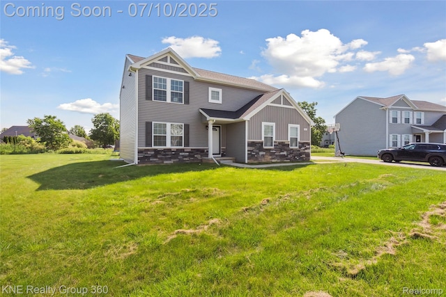 7057 Primrose Ln, Grand Blanc, MI 48439 - view of front of property featuring stone siding, a front yard, and board and batten siding