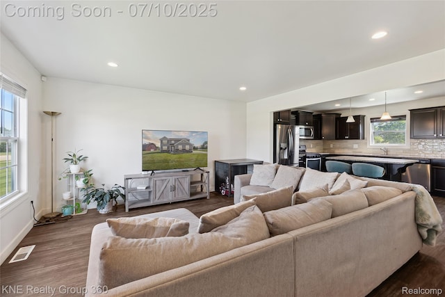7057 Primrose Ln, Grand Blanc, MI 48439 - living area with recessed lighting and dark wood-style floors