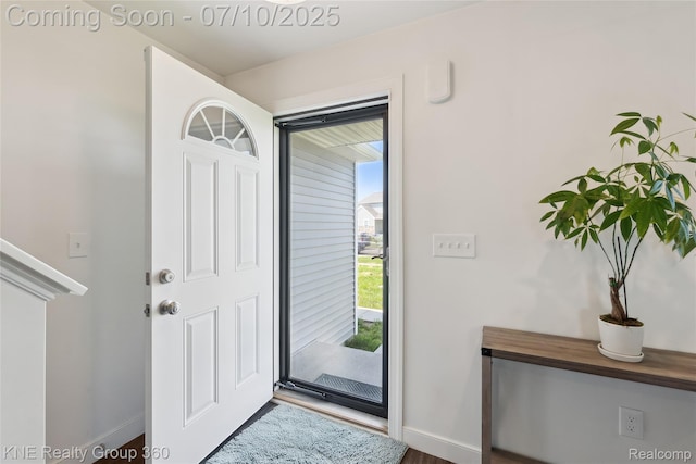 7057 Primrose Ln, Grand Blanc, MI 48439 - foyer featuring baseboards and wood finished floors