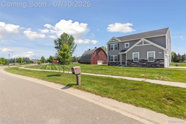 7057 Primrose Ln, Grand Blanc, MI 48439 - view of front of property with stone siding, a barn, a front yard, and an outdoor structure