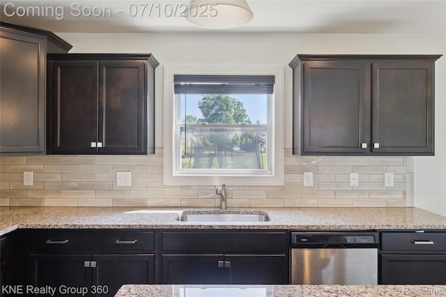 7057 Primrose Ln, Grand Blanc, MI 48439 - kitchen with dishwasher, backsplash, dark brown cabinets, and light stone counters