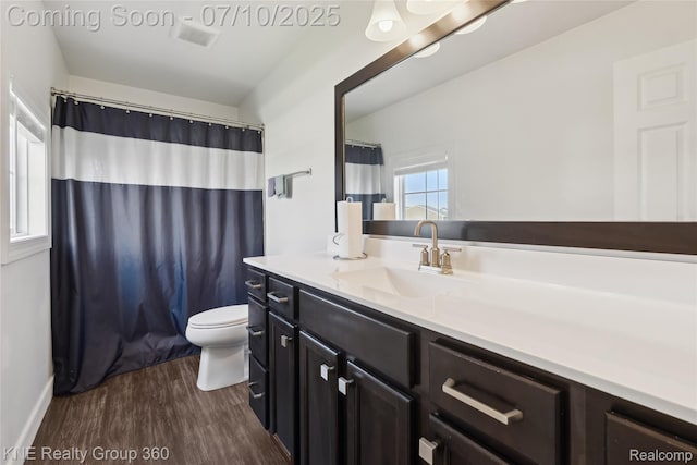 7057 Primrose Ln, Grand Blanc, MI 48439 - bathroom with wood finished floors, vanity, and a shower with curtain