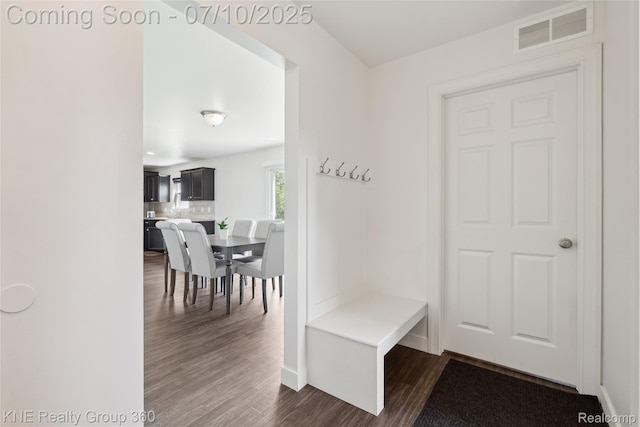 7057 Primrose Ln, Grand Blanc, MI 48439 - mudroom with dark wood finished floors and baseboards