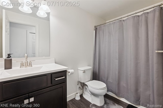 7057 Primrose Ln, Grand Blanc, MI 48439 - bathroom with vanity, wood finished floors, and curtained shower