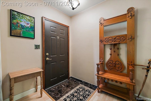 4674 Chapel Dr, Troy, MI 48085 - entryway with baseboards and wood finished floors