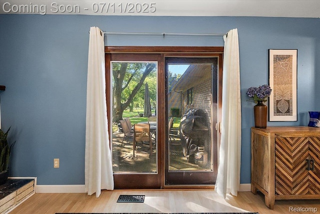 4674 Chapel Dr, Troy, MI 48085 - doorway to outside with wood finished floors and baseboards