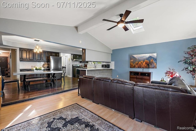 4674 Chapel Dr, Troy, MI 48085 - living room featuring ceiling fan, light wood-type flooring, and a skylight