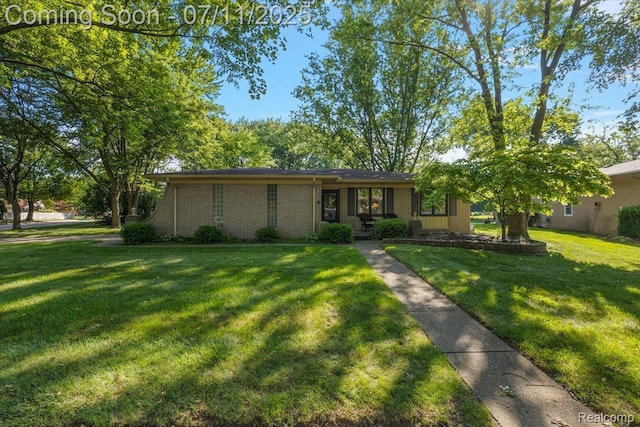 4674 Chapel Dr, Troy, MI 48085 - view of front facade with a front yard and brick siding