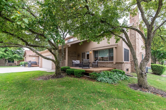 37516 N Laurel Park Dr, Livonia, MI 48152 - view of front of house with brick siding, concrete driveway, a front yard, and an attached garage