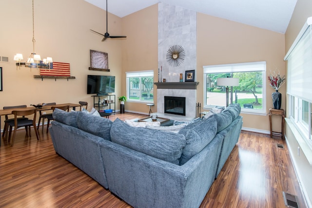 37516 N Laurel Park Dr, Livonia, MI 48152 - living room featuring high vaulted ceiling, wood finished floors, a chandelier, and a fireplace
