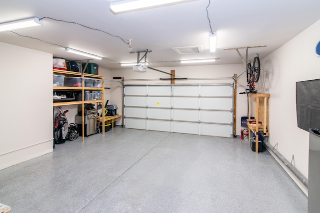37516 N Laurel Park Dr, Livonia, MI 48152 - garage featuring a garage door opener