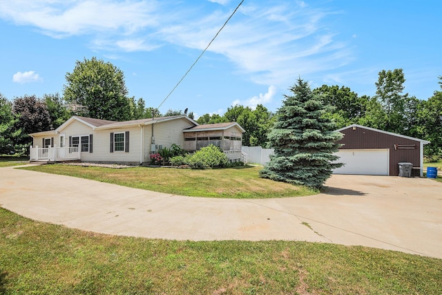 36466 M 40, Paw Paw, MI 49079 - view of front of home featuring a garage, an outdoor structure, and a front yard