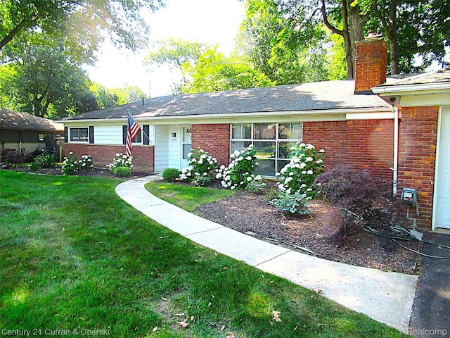 34005 Alta Loma Dr, Farmington, MI 48335 - single story home with brick siding, a front yard, and a chimney