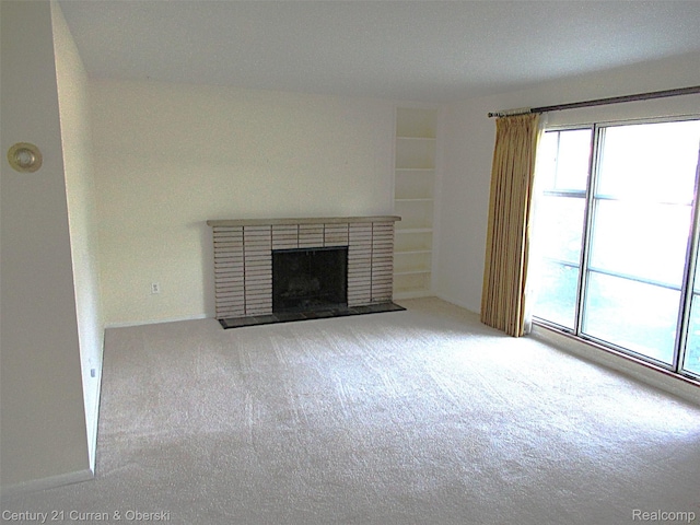 34005 Alta Loma Dr, Farmington, MI 48335 - unfurnished living room with carpet floors and a brick fireplace