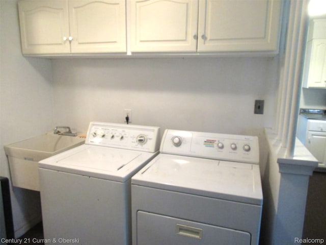34005 Alta Loma Dr, Farmington, MI 48335 - laundry area with separate washer and dryer and cabinet space