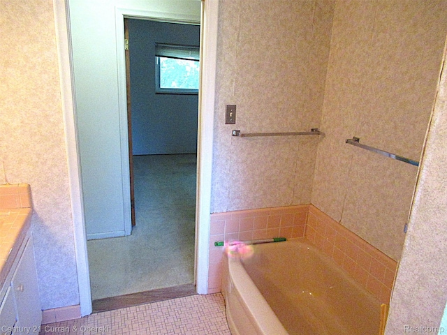 34005 Alta Loma Dr, Farmington, MI 48335 - bathroom featuring a garden tub, vanity, and tile patterned floors