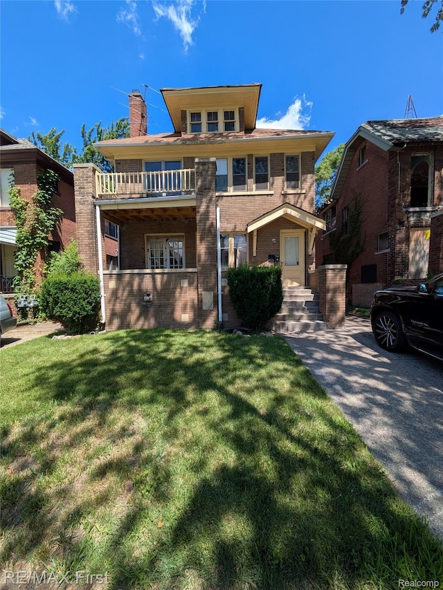4342 Tyler St, Detroit, MI 48238 - view of front of property with a chimney, a front lawn, brick siding, and a balcony