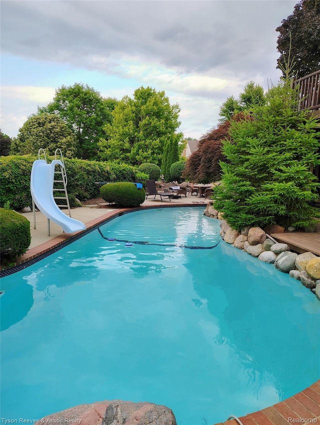 22770 Shadowglen Dr, Farmington Hills, MI 48335 - outdoor pool with a water slide and a patio
