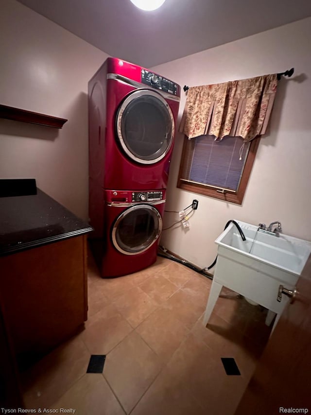 22770 Shadowglen Dr, Farmington Hills, MI 48335 - laundry room featuring stacked washing machine and dryer and light tile patterned flooring