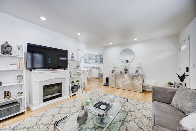 29755 Rosemond Dr, Southfield, MI 48025 - living room with radiator heating unit, wood finished floors, recessed lighting, and a high end fireplace
