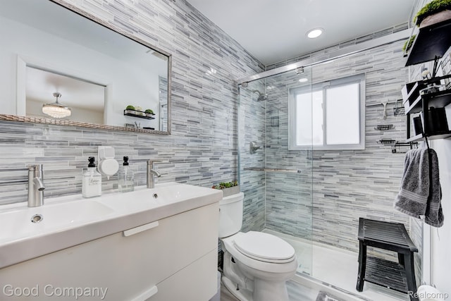 29755 Rosemond Dr, Southfield, MI 48025 - full bathroom featuring tile walls, a shower stall, double vanity, and backsplash