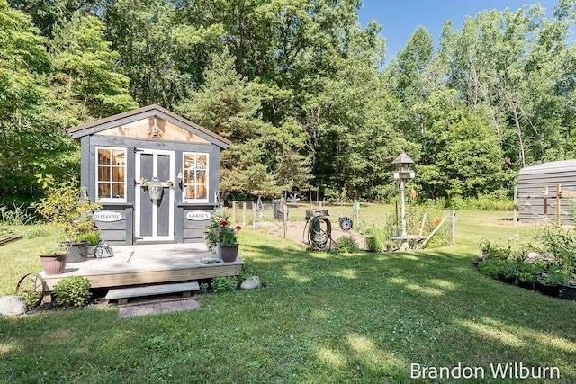 2289 S Sullivan Rd, Ravenna, MI 49451 - view of green lawn with an outdoor structure
