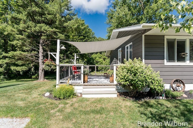 2289 S Sullivan Rd, Ravenna, MI 49451 - view of grassy yard featuring a wooden deck