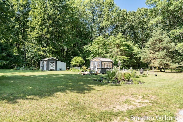 2289 S Sullivan Rd, Ravenna, MI 49451 - view of yard featuring a storage shed
