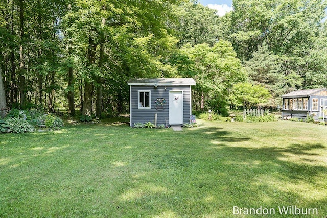 2289 S Sullivan Rd, Ravenna, MI 49451 - view of green lawn with a storage shed