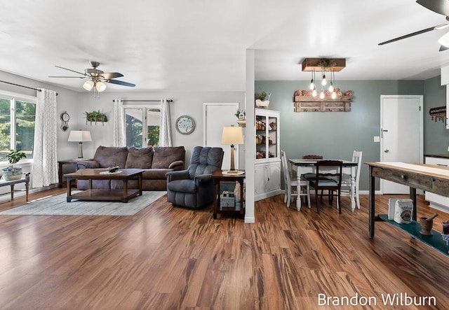 2289 S Sullivan Rd, Ravenna, MI 49451 - living area with ceiling fan, healthy amount of natural light, and wood finished floors