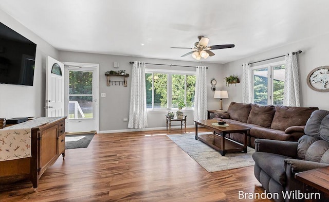 2289 S Sullivan Rd, Ravenna, MI 49451 - living room with healthy amount of natural light, ceiling fan, and wood finished floors