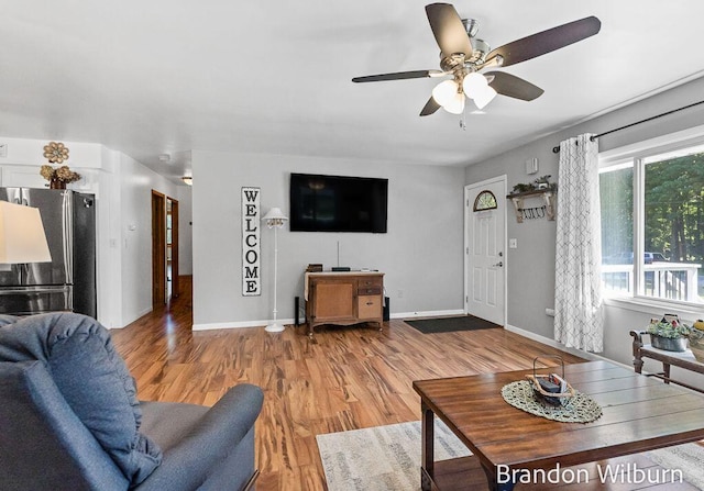 2289 S Sullivan Rd, Ravenna, MI 49451 - living room with a ceiling fan and wood finished floors