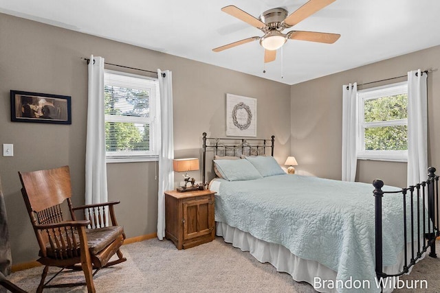 2289 S Sullivan Rd, Ravenna, MI 49451 - bedroom featuring light carpet, multiple windows, and a ceiling fan
