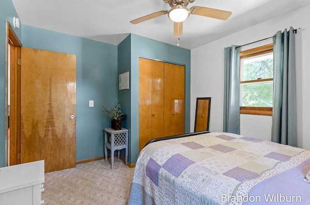 2289 S Sullivan Rd, Ravenna, MI 49451 - bedroom with light colored carpet, a closet, and ceiling fan