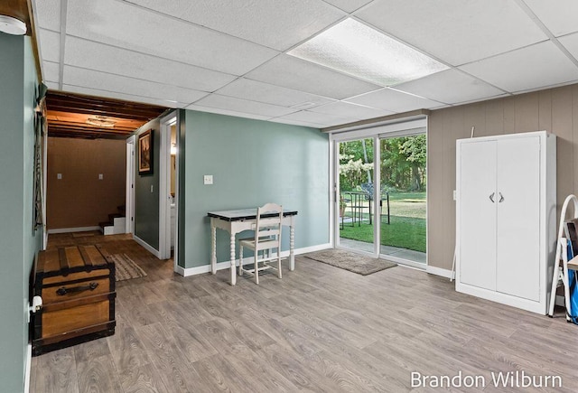 2289 S Sullivan Rd, Ravenna, MI 49451 - interior space featuring a paneled ceiling and wood finished floors
