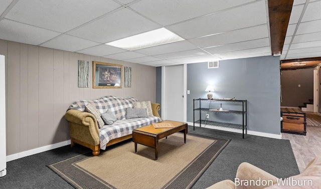 2289 S Sullivan Rd, Ravenna, MI 49451 - living room featuring a paneled ceiling and carpet